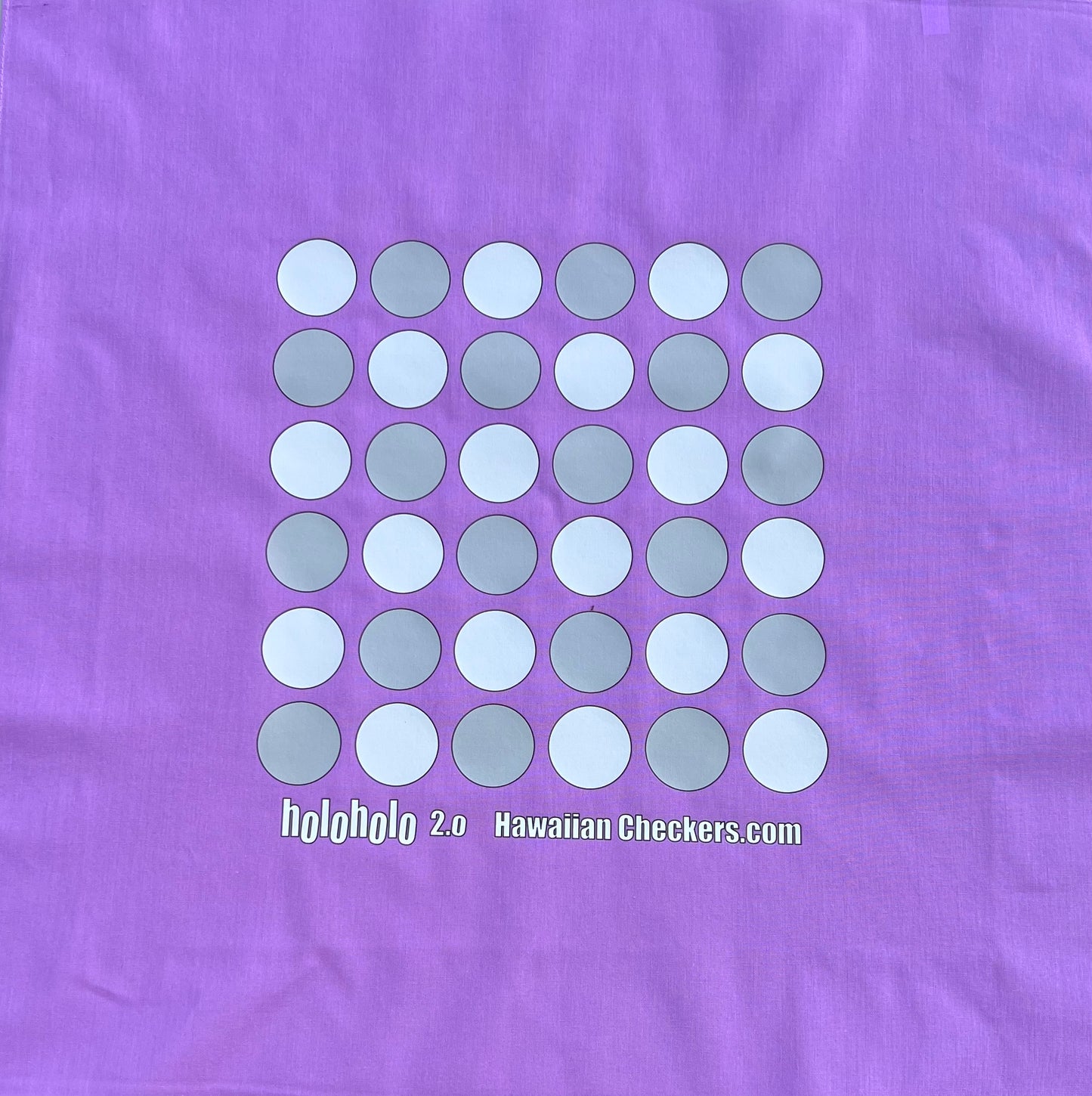 Purple fabric with a pattern of white and gray circles and text 'holoholo 2.0 Hawaiian Checkers.com'.